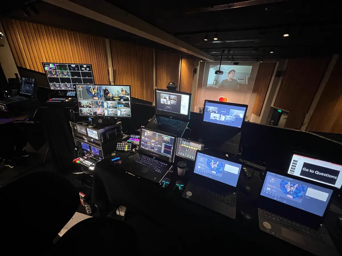 A webinar control position with remote presenters on screen